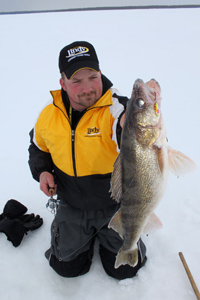 image of Jonny Petrowske holding Walleye on Lake of the Woods